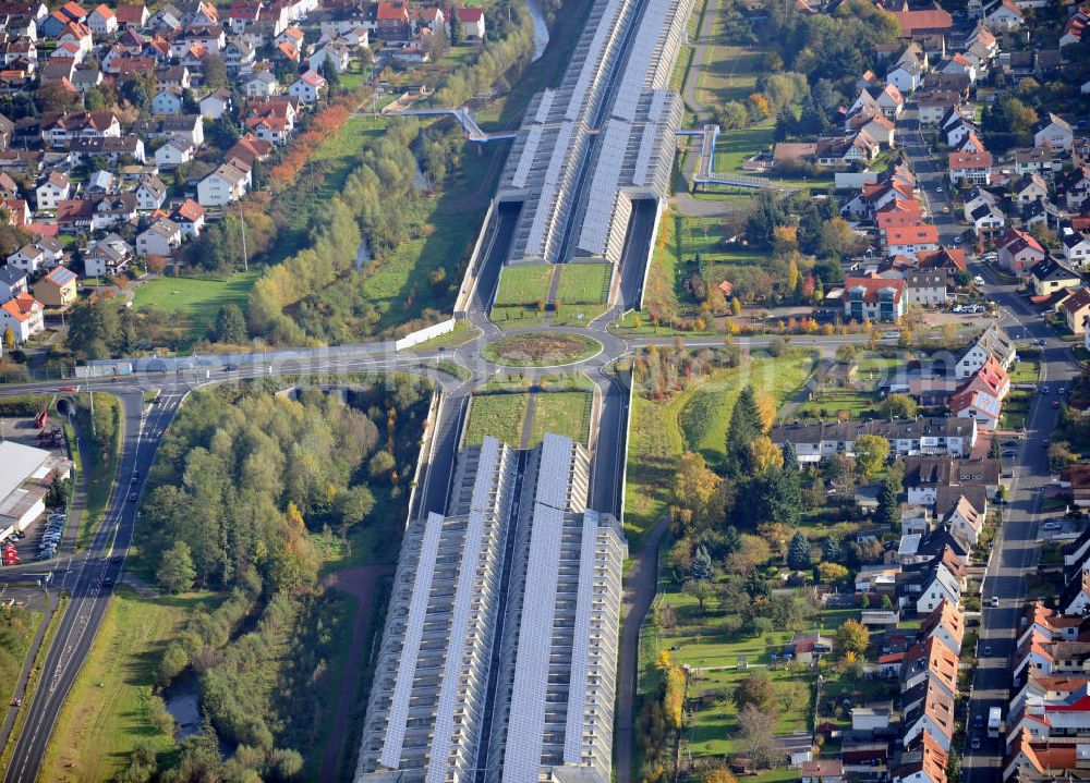 Goldbach from the bird's eye view: Die längste Photovoltaikanlage / Solaranlage der Welt befindet sich auf dem Dach der Autobahn-Einhausung der A 3 bei Aschaffenburg in Baden-Württemberg. Betreiber ist das Elektrizitätswerk Goldbach Hösbach. The world longest photovoltaic power plant / solar power system of the freeway E 41 is on the roof of the Motorway-enclosure near Aschaffenburg in Baden-Wuerttemberg.