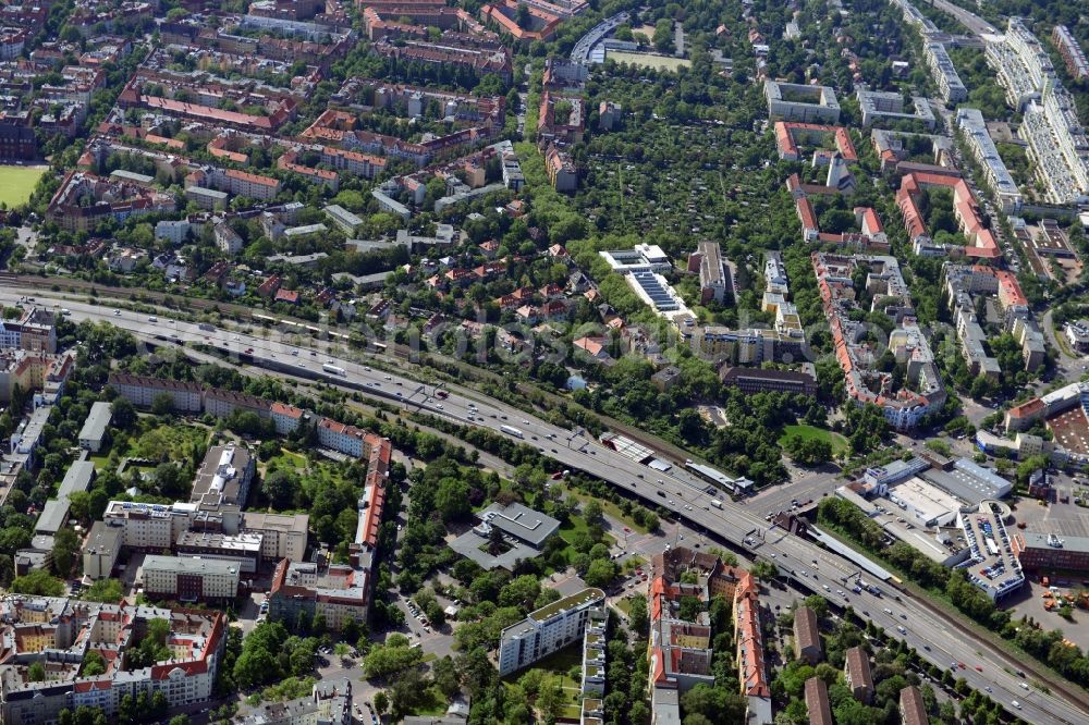 Aerial image Berlin - The A100 motorway crosses at Heidelberger Platz, the Mecklenburg Street in the borough of Charlottenburg-Wilmersdorf of Berlin. At Heidelberg S-Bahn station Audi has an establishment. Also, the book publisher Springer has here his Berlin address. On the opposite side of the highway there is a bathhouse Wilmersdorf