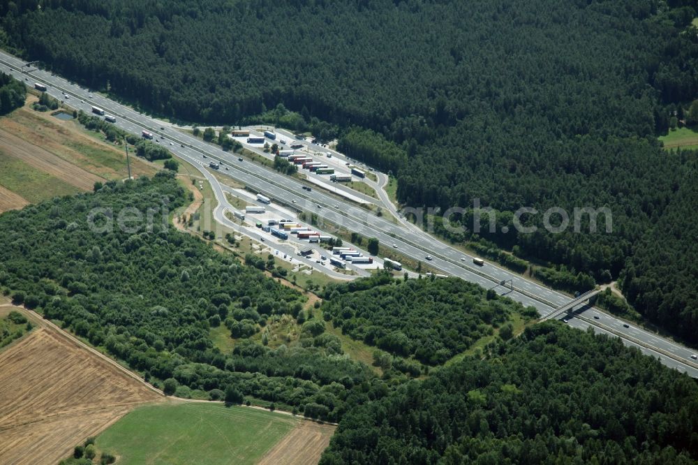 Aerial photograph Schnaittach - Routing and traffic lanes during the motorway service station and parking lot of the BAB A 9 near Schnaittach in the state Bavaria