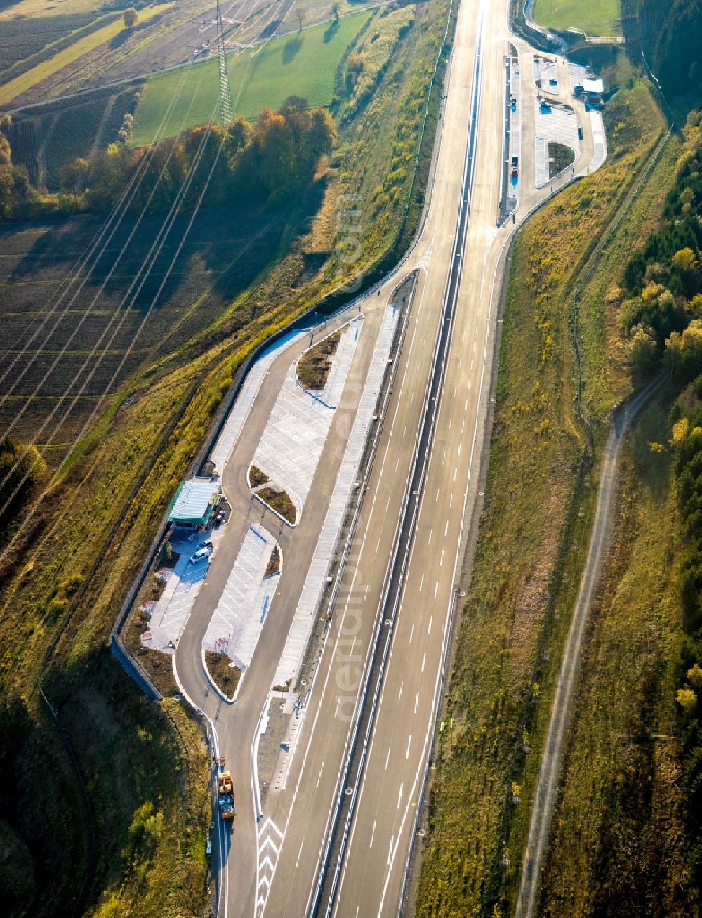 Bestwig from the bird's eye view: Motorway service area and car park along the route and lanes in the course of the federal higway - motorway BAB A46 in Bestwig in the state North Rhine-Westphalia, Germany