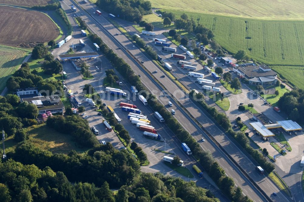 Knüllwald from the bird's eye view: Routing and traffic lanes during the motorway service station and parking lot of the BAB A7 in Knuellwald in the state Hesse, Germany