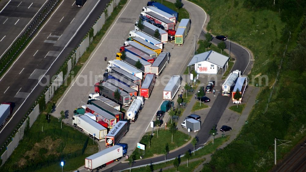 Neustadt (Wied) from the bird's eye view: Lorries - parking spaces at the highway rest stop and parking of the BAB A 3 in Neustadt (Wied) in the state Rhineland-Palatinate, Germany