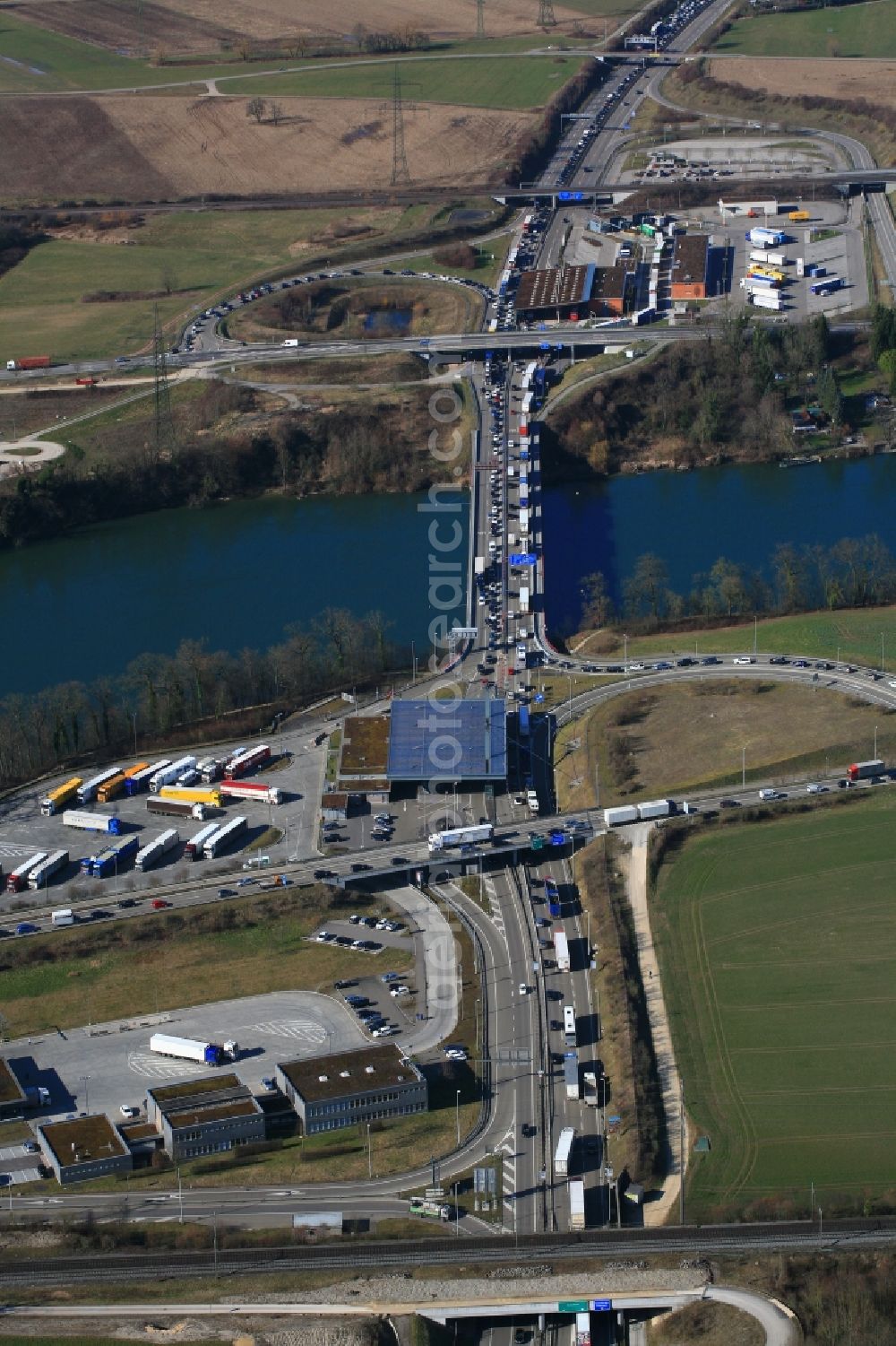 Aerial image Rheinfelden - Highway congestion along the route of the lanes of the motorway A861 over the bridge at the river Rhine at the border and customs buildings of Switzerland and Germany in Rheinfelden in the canton Aargau, Switzerland