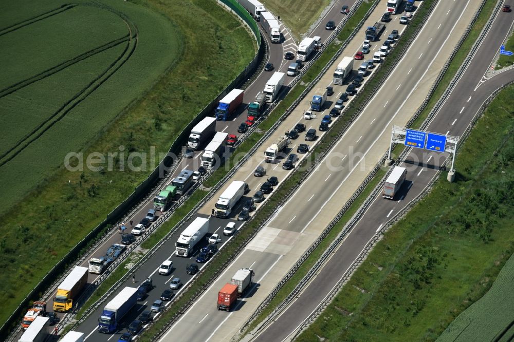 Ilberstedt from the bird's eye view: Highway jam along the route of the lanes A14 at the departure Bernburg in Ilberstedt in the state Saxony-Anhalt