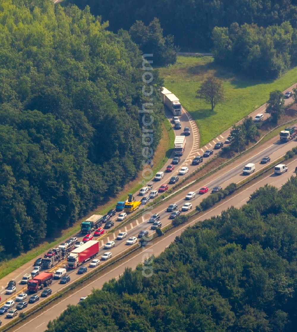 Hagen from the bird's eye view: Highway congestion along the route of the lanes A45 at the ramp with direction to Dortmund in Hagen in the state North Rhine-Westphalia