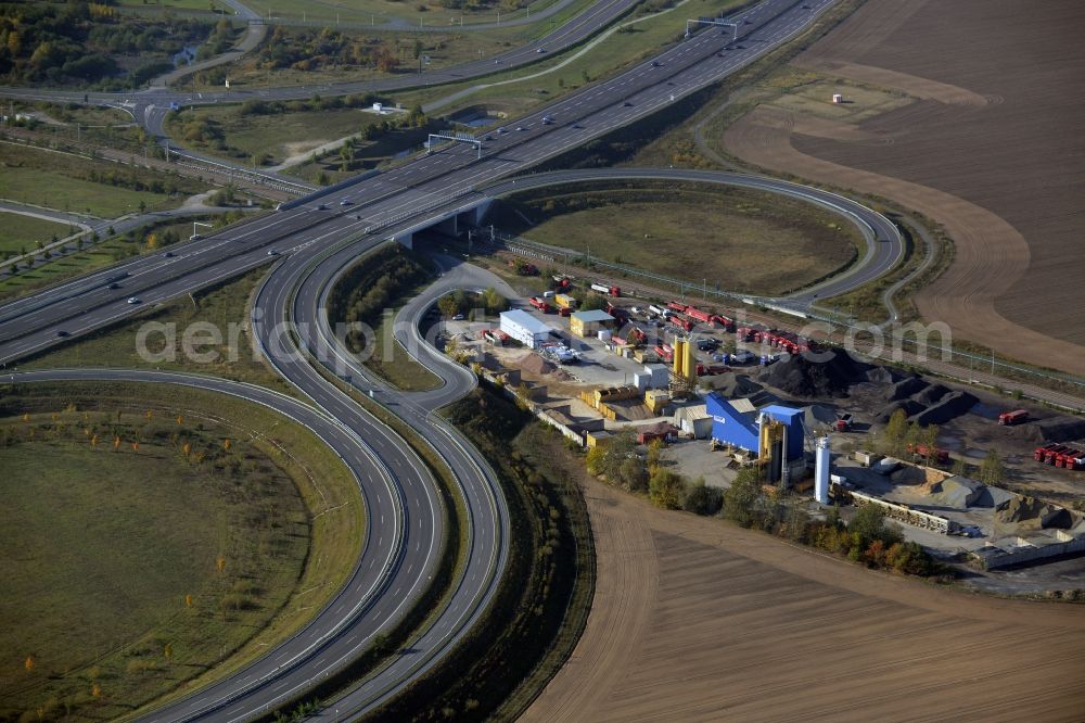 Aerial photograph Schönefeld - Course of the federal motorway A113 in Waltersdorf in the state of Brandenburg. The works of the concrete producer AMBB GmbH are located adjacent to the road and the Berliner Chaussee street