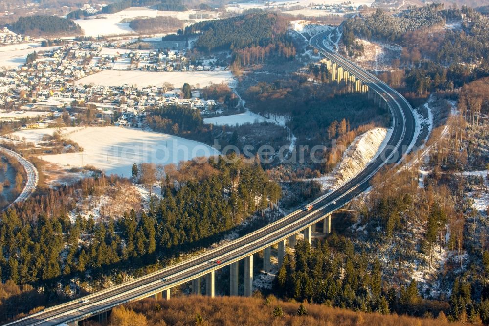 Arnsberg from above - Course of the federal motorway A46 in the South of snow-covered Oeventrop in the state of North Rhine-Westphalia