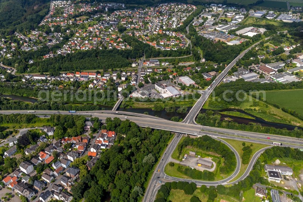 Arnsberg from the bird's eye view: Lanes of the motorway- route and course of the A46 ueber of Landstrasse L745 in Arnsberg in the state North Rhine-Westphalia, Germany