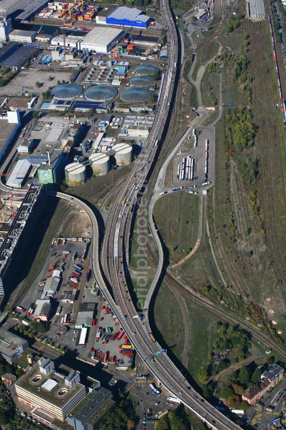 Basel from the bird's eye view: Lanes of the motorway- route and course of the Swiss motorway A2 at the truck parking place close to the transshipment Station in Basel, Switzerland