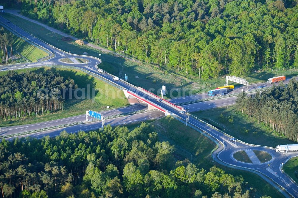 Aerial image Kremmen - Routing and traffic lanes during the highway exit and access the motorway A 24 in Kremmen in the state Brandenburg, Germany