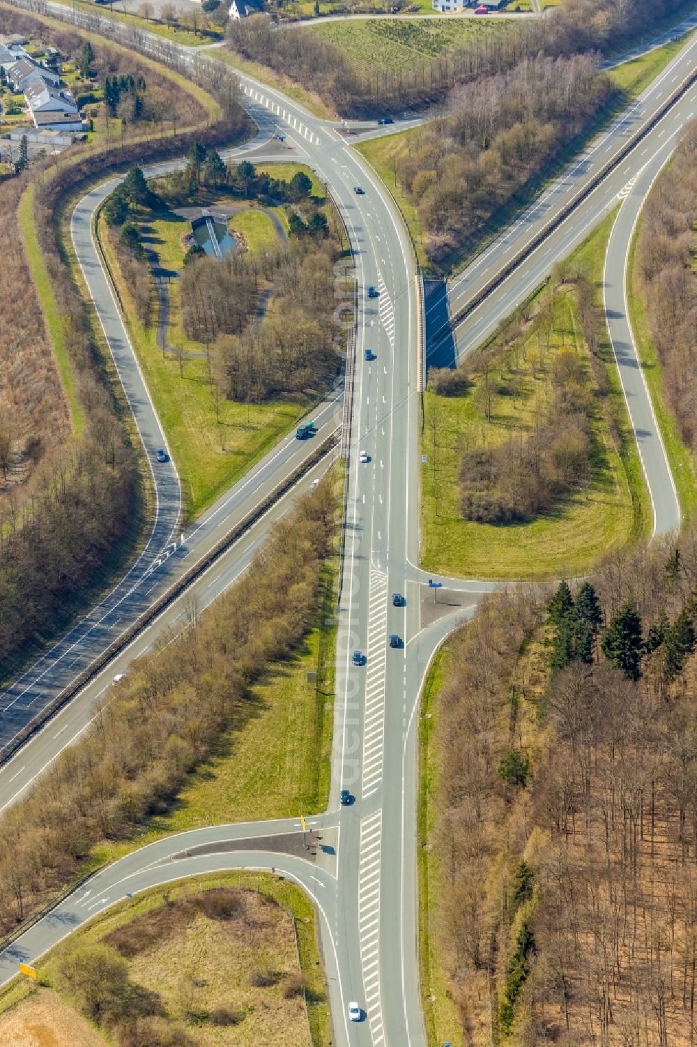 Meschede from above - Routing and traffic lanes during the highway exit and access the motorway A 46 in Meschede in the state North Rhine-Westphalia, Germany