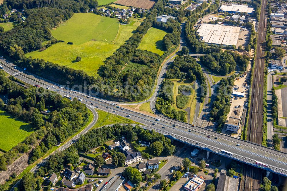 Schwelm from the bird's eye view: Route and lanes in the course of the Autobahn exit and Autobahn driveway of the BAB1 with Autobahn bridge in the district of Jesinghausen in Schwelm in the state of North Rhine-Westphalia, Germany