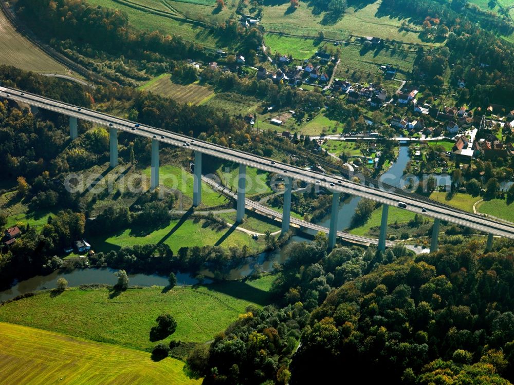 Eisenach from the bird's eye view: Motorway bridge of the A4 in Eisenach in the state of Thuringia. The bridge spans the river Werra. The Hoerschel part of Eisenach is located on its riverbank. The bridge with its high pillars is located between two hills on Werra Valley