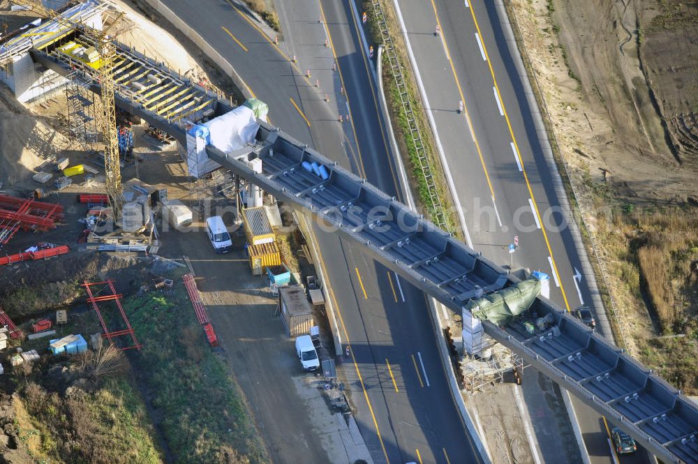 Aerial photograph SCHWANEBECK - Baustelle vom Autobahndreieck Kreuz Barnim, vormals AD Schwanebeck, mit Aus- und Umbauarbeiten. Die EUROVIA führt im Auftrag des Landesbetrieb Brandenburg umfangreiche Abbruch-, Erdarbeiten und den Neubau von Brückenbauwerken zum Um- und Ausbau des Autobahndreiecks (AD) Barnim am nördlichen Berliner Ring durch. View of the construction site at the highway triangle Kreuz Barnim.