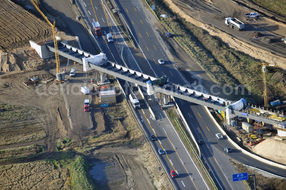 Aerial photograph SCHWANEBECK - Baustelle vom Autobahndreieck Kreuz Barnim, vormals AD Schwanebeck, mit Aus- und Umbauarbeiten. Die EUROVIA führt im Auftrag des Landesbetrieb Brandenburg umfangreiche Abbruch-, Erdarbeiten und den Neubau von Brückenbauwerken zum Um- und Ausbau des Autobahndreiecks (AD) Barnim am nördlichen Berliner Ring durch. View of the construction site at the highway triangle Kreuz Barnim.