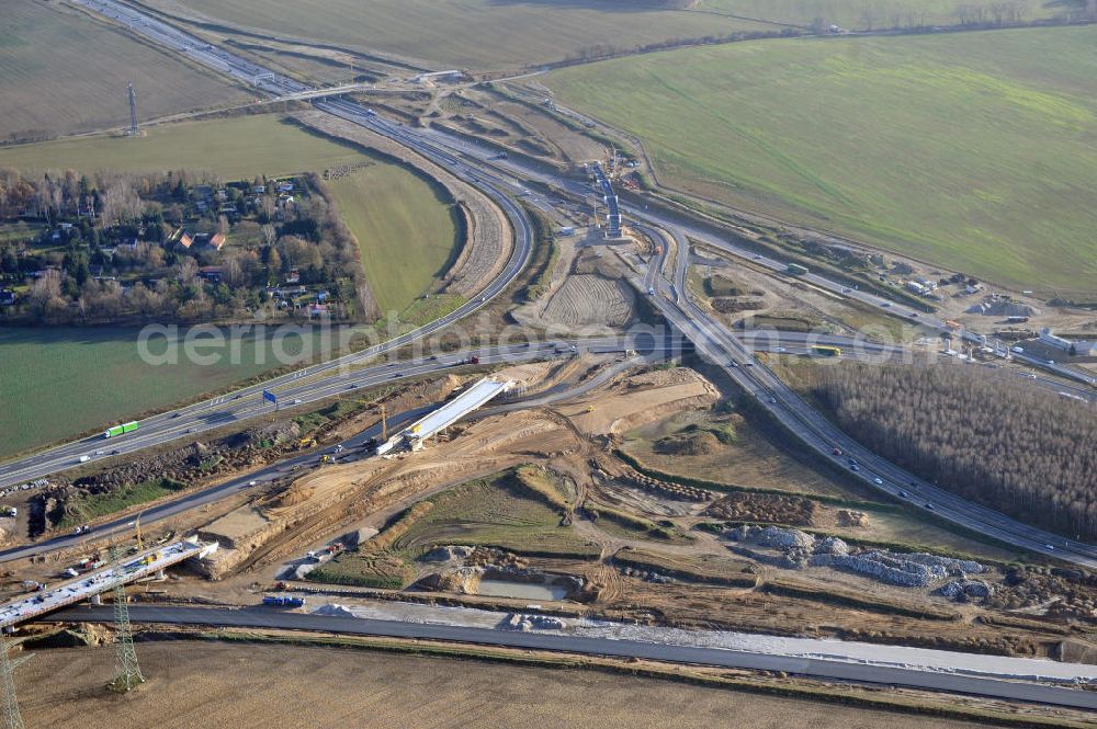 Aerial photograph SCHWANEBECK - Baustelle vom Autobahndreieck Kreuz Barnim, vormals AD Schwanebeck, mit Aus- und Umbauarbeiten. Die EUROVIA führt im Auftrag des Landesbetrieb Brandenburg umfangreiche Abbruch-, Erdarbeiten und den Neubau von Brückenbauwerken zum Um- und Ausbau des Autobahndreiecks (AD) Barnim am nördlichen Berliner Ring durch. View of the construction site at the highway triangle Kreuz Barnim.