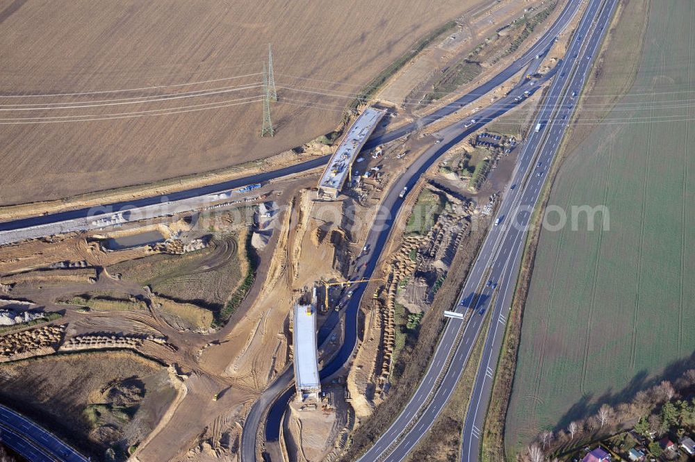 Aerial photograph SCHWANEBECK - Baustelle vom Autobahndreieck Kreuz Barnim, vormals AD Schwanebeck, mit Aus- und Umbauarbeiten. Die EUROVIA führt im Auftrag des Landesbetrieb Brandenburg umfangreiche Abbruch-, Erdarbeiten und den Neubau von Brückenbauwerken zum Um- und Ausbau des Autobahndreiecks (AD) Barnim am nördlichen Berliner Ring durch. View of the construction site at the highway triangle Kreuz Barnim.