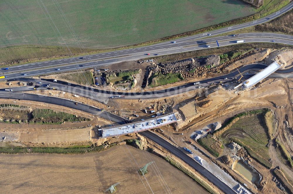 Aerial photograph SCHWANEBECK - Baustelle vom Autobahndreieck Kreuz Barnim, vormals AD Schwanebeck, mit Aus- und Umbauarbeiten. Die EUROVIA führt im Auftrag des Landesbetrieb Brandenburg umfangreiche Abbruch-, Erdarbeiten und den Neubau von Brückenbauwerken zum Um- und Ausbau des Autobahndreiecks (AD) Barnim am nördlichen Berliner Ring durch. View of the construction site at the highway triangle Kreuz Barnim.