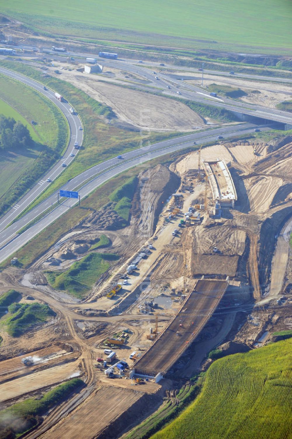 Schwanebeck from the bird's eye view: Baustelle vom Autobahndreieck Kreuz Barnim, vormals AD Schwanebeck, mit Aus- und Umbauarbeiten. Die EUROVIA führt im Auftrag des Landesbetrieb Brandenburg umfangreiche Abbruch-, Erdarbeiten und den Neubau von Brückenbauwerken zum Um- und Ausbau des Autobahndreiecks (AD) Barnim am nördlichen Berliner Ring durch. View of the construction site at the highway triangle Kreuz Barnim.