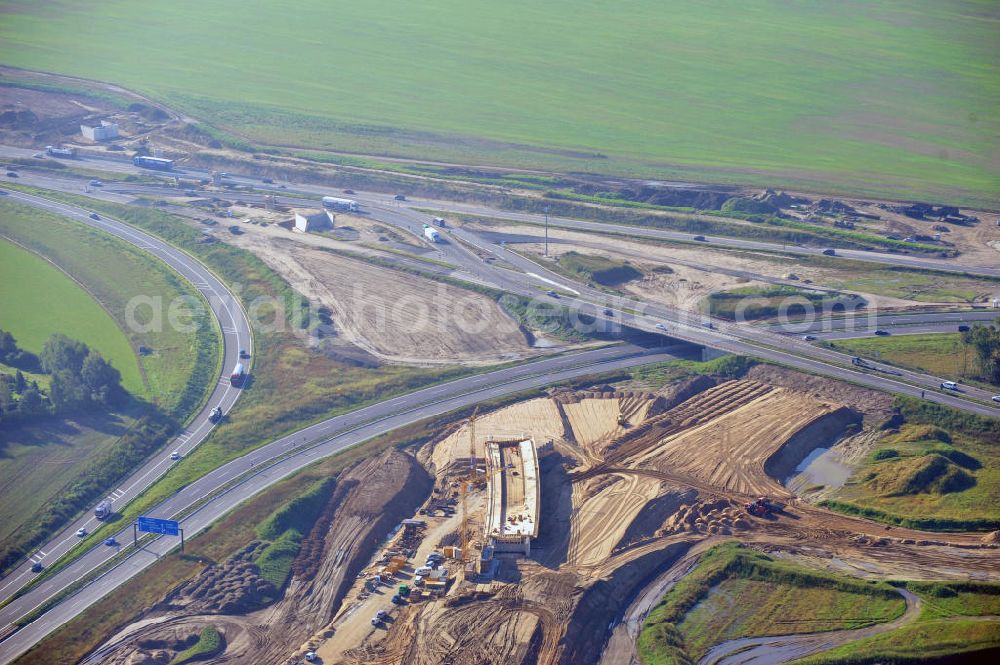 Aerial photograph Schwanebeck - Baustelle vom Autobahndreieck Kreuz Barnim, vormals AD Schwanebeck, mit Aus- und Umbauarbeiten. Die EUROVIA führt im Auftrag des Landesbetrieb Brandenburg umfangreiche Abbruch-, Erdarbeiten und den Neubau von Brückenbauwerken zum Um- und Ausbau des Autobahndreiecks (AD) Barnim am nördlichen Berliner Ring durch. View of the construction site at the highway triangle Kreuz Barnim.