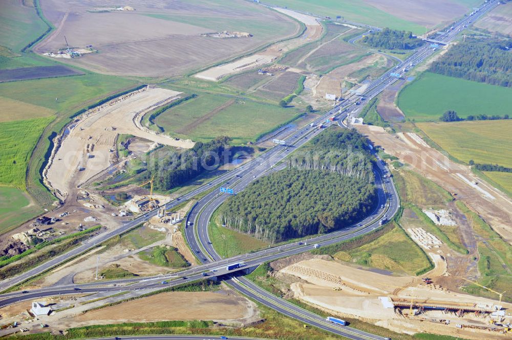 Schwanebeck from the bird's eye view: Baustelle vom Autobahndreieck Kreuz Barnim, vormals AD Schwanebeck, mit Aus- und Umbauarbeiten. Die EUROVIA führt im Auftrag des Landesbetrieb Brandenburg umfangreiche Abbruch-, Erdarbeiten und den Neubau von Brückenbauwerken zum Um- und Ausbau des Autobahndreiecks (AD) Barnim am nördlichen Berliner Ring durch. View of the construction site at the highway triangle Kreuz Barnim.