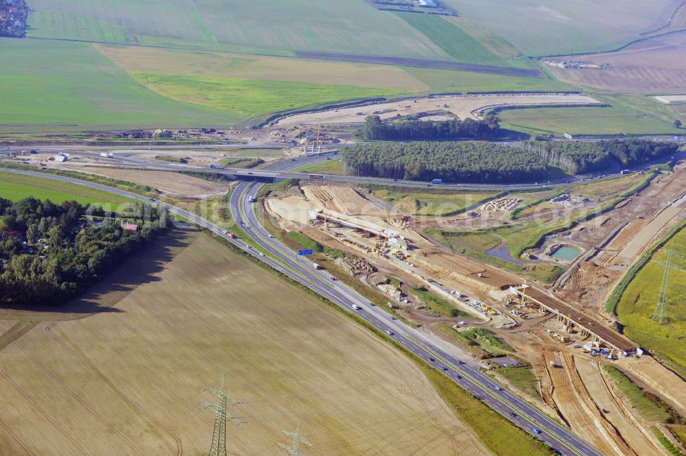 Aerial photograph Schwanebeck - Baustelle vom Autobahndreieck Kreuz Barnim, vormals AD Schwanebeck, mit Aus- und Umbauarbeiten. Die EUROVIA führt im Auftrag des Landesbetrieb Brandenburg umfangreiche Abbruch-, Erdarbeiten und den Neubau von Brückenbauwerken zum Um- und Ausbau des Autobahndreiecks (AD) Barnim am nördlichen Berliner Ring durch. View of the construction site at the highway triangle Kreuz Barnim.