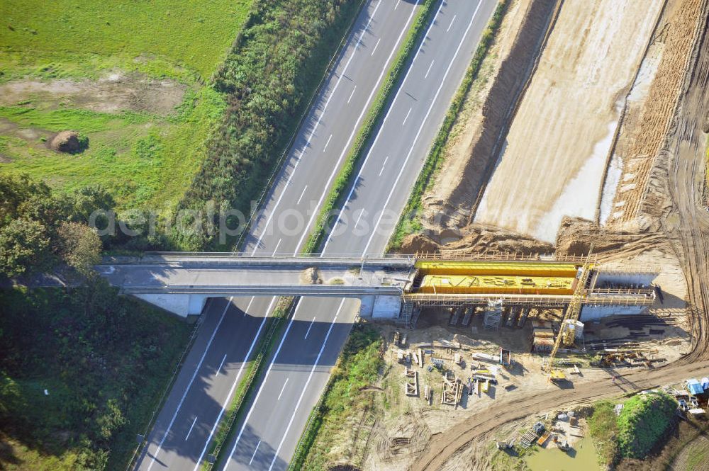 Schwanebeck from the bird's eye view: Baustelle vom Autobahndreieck Kreuz Barnim, vormals AD Schwanebeck, mit Aus- und Umbauarbeiten. Die EUROVIA führt im Auftrag des Landesbetrieb Brandenburg umfangreiche Abbruch-, Erdarbeiten und den Neubau von Brückenbauwerken zum Um- und Ausbau des Autobahndreiecks (AD) Barnim am nördlichen Berliner Ring durch. View of the construction site at the highway triangle Kreuz Barnim.