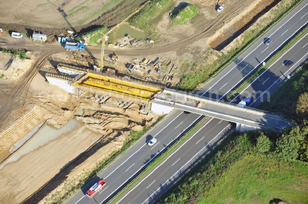 Aerial photograph Schwanebeck - Baustelle vom Autobahndreieck Kreuz Barnim, vormals AD Schwanebeck, mit Aus- und Umbauarbeiten. Die EUROVIA führt im Auftrag des Landesbetrieb Brandenburg umfangreiche Abbruch-, Erdarbeiten und den Neubau von Brückenbauwerken zum Um- und Ausbau des Autobahndreiecks (AD) Barnim am nördlichen Berliner Ring durch. View of the construction site at the highway triangle Kreuz Barnim.