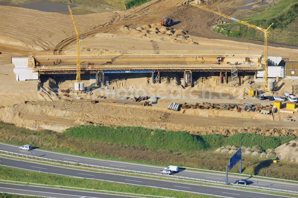 Schwanebeck from the bird's eye view: Baustelle vom Autobahndreieck Kreuz Barnim, vormals AD Schwanebeck, mit Aus- und Umbauarbeiten. Die EUROVIA führt im Auftrag des Landesbetrieb Brandenburg umfangreiche Abbruch-, Erdarbeiten und den Neubau von Brückenbauwerken zum Um- und Ausbau des Autobahndreiecks (AD) Barnim am nördlichen Berliner Ring durch. View of the construction site at the highway triangle Kreuz Barnim.