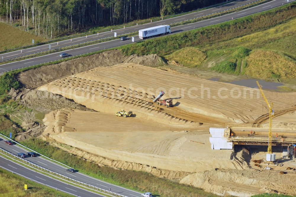 Aerial image Schwanebeck - Baustelle vom Autobahndreieck Kreuz Barnim, vormals AD Schwanebeck, mit Aus- und Umbauarbeiten. Die EUROVIA führt im Auftrag des Landesbetrieb Brandenburg umfangreiche Abbruch-, Erdarbeiten und den Neubau von Brückenbauwerken zum Um- und Ausbau des Autobahndreiecks (AD) Barnim am nördlichen Berliner Ring durch. View of the construction site at the highway triangle Kreuz Barnim.