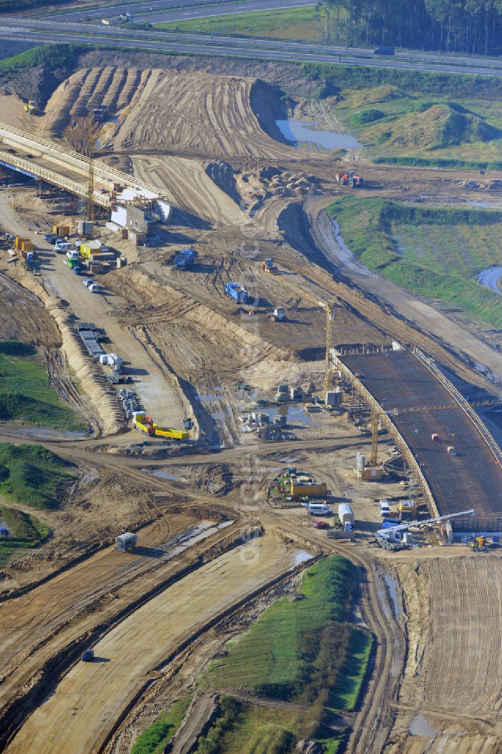 Schwanebeck from the bird's eye view: Baustelle vom Autobahndreieck Kreuz Barnim, vormals AD Schwanebeck, mit Aus- und Umbauarbeiten. Die EUROVIA führt im Auftrag des Landesbetrieb Brandenburg umfangreiche Abbruch-, Erdarbeiten und den Neubau von Brückenbauwerken zum Um- und Ausbau des Autobahndreiecks (AD) Barnim am nördlichen Berliner Ring durch. View of the construction site at the highway triangle Kreuz Barnim.