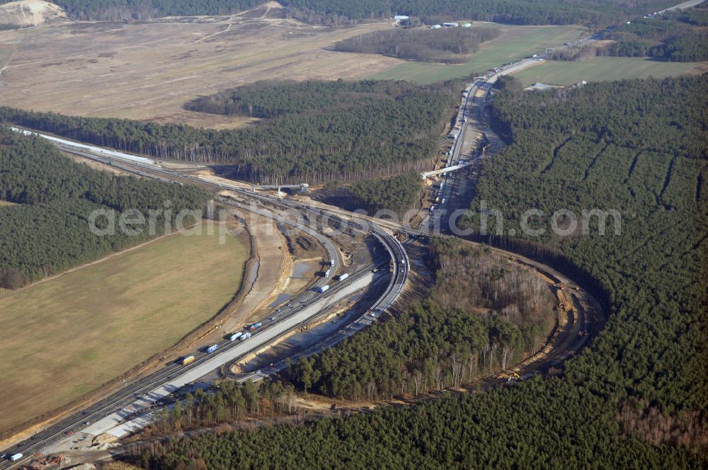 Aerial image Nuthetal bei Saarmund / BRB - Nuthetal Das Autobahndreieck Nuthetal (A 10 und A 115) bei Potsdam, aufgenommen aus der Luft am 23.01.2008. Das am stärksten befahrene Autobahnteilstück Brandenburgs wird derzeit für 34 Millionen Euro umgebaut.Die Bauarbeiten des Landesbetriebes Straßenwesen beinhalten u.a. den Ausbau des Verbindungsteilstücks zwischen der A 10 und der A 115 , er wird bis 2010 dauern. Während hier derzeit täglich knapp 153.000 Fahrzeuge gezählt werden, sollen es 2015 bereits mehr als 200.000 sein. Ausführende Firmen sind die EUROVIA VBU und BERGER BAU.