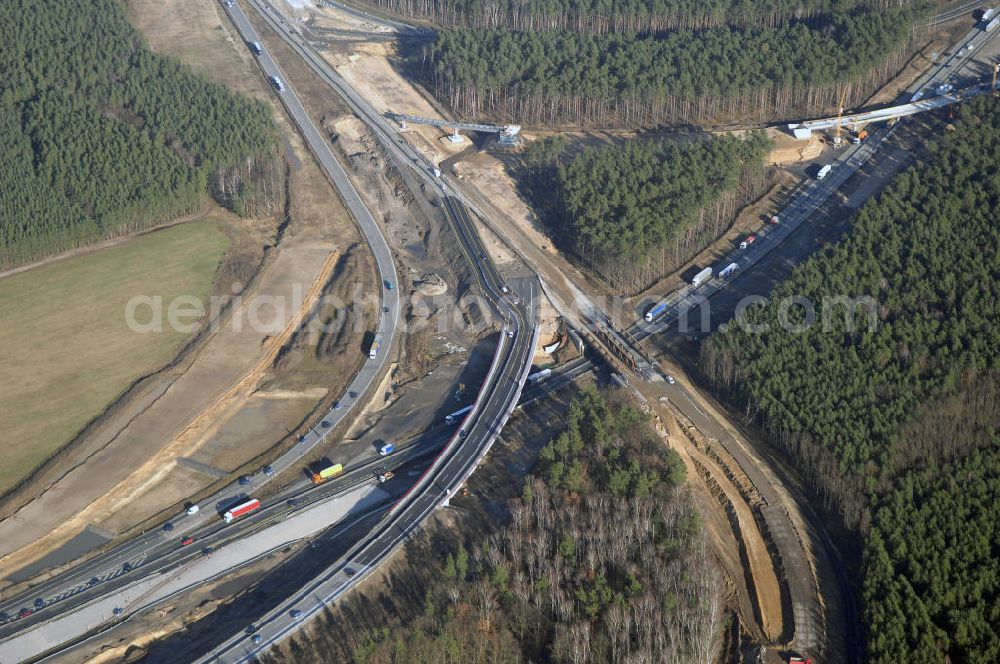 Aerial image Nuthetal bei Saarmund / BRB - Nuthetal Das Autobahndreieck Nuthetal (A 10 und A 115) bei Potsdam, aufgenommen aus der Luft am 23.01.2008. Das am stärksten befahrene Autobahnteilstück Brandenburgs wird derzeit für 34 Millionen Euro umgebaut.Die Bauarbeiten des Landesbetriebes Straßenwesen beinhalten u.a. den Ausbau des Verbindungsteilstücks zwischen der A 10 und der A 115 , er wird bis 2010 dauern. Während hier derzeit täglich knapp 153.000 Fahrzeuge gezählt werden, sollen es 2015 bereits mehr als 200.000 sein. Ausführende Firmen sind die EUROVIA VBU und BERGER BAU.