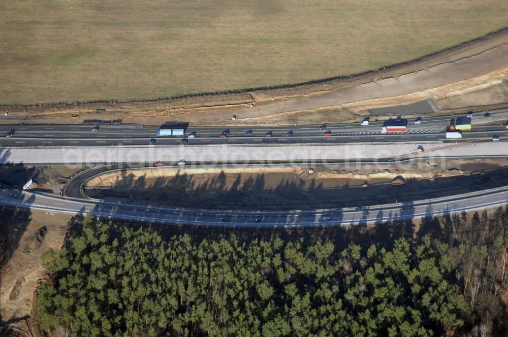 Aerial photograph Nuthetal bei Saarmund / BRB - Nuthetal Das Autobahndreieck Nuthetal (A 10 und A 115) bei Potsdam, aufgenommen aus der Luft am 23.01.2008. Das am stärksten befahrene Autobahnteilstück Brandenburgs wird derzeit für 34 Millionen Euro umgebaut.Die Bauarbeiten des Landesbetriebes Straßenwesen beinhalten u.a. den Ausbau des Verbindungsteilstücks zwischen der A 10 und der A 115 , er wird bis 2010 dauern. Während hier derzeit täglich knapp 153.000 Fahrzeuge gezählt werden, sollen es 2015 bereits mehr als 200.000 sein. Ausführende Firmen sind die EUROVIA VBU und BERGER BAU.