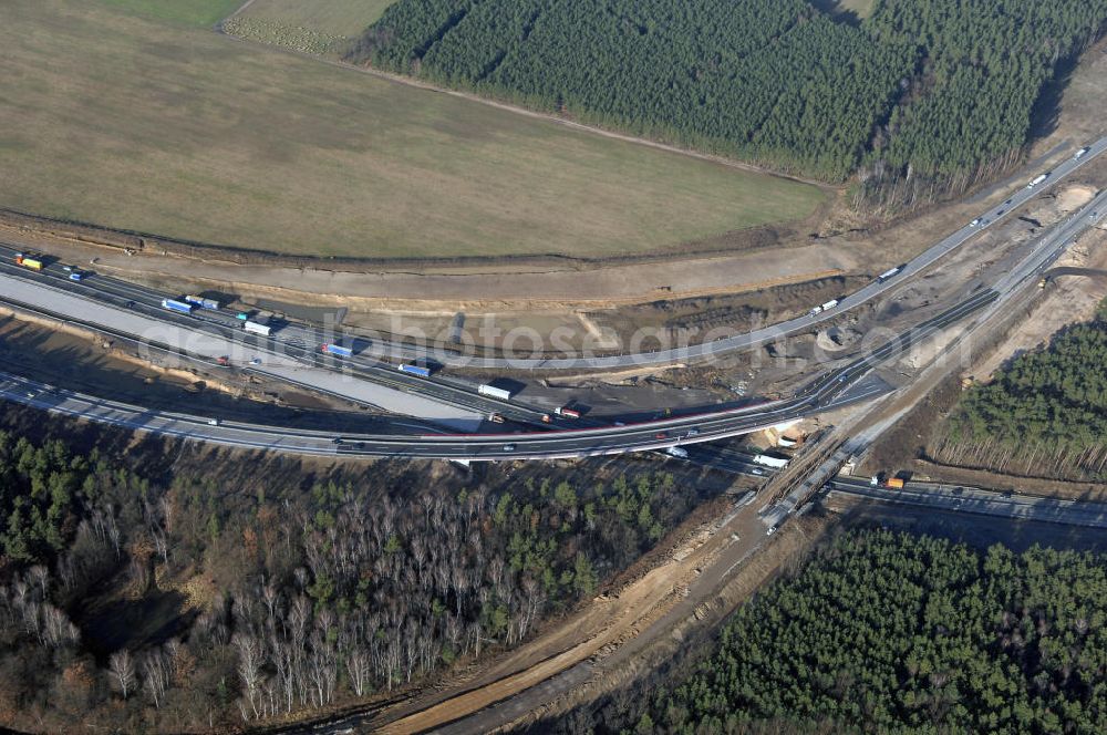 Nuthetal bei Saarmund / BRB from the bird's eye view: Nuthetal Das Autobahndreieck Nuthetal (A 10 und A 115) bei Potsdam, aufgenommen aus der Luft am 23.01.2008. Das am stärksten befahrene Autobahnteilstück Brandenburgs wird derzeit für 34 Millionen Euro umgebaut.Die Bauarbeiten des Landesbetriebes Straßenwesen beinhalten u.a. den Ausbau des Verbindungsteilstücks zwischen der A 10 und der A 115 , er wird bis 2010 dauern. Während hier derzeit täglich knapp 153.000 Fahrzeuge gezählt werden, sollen es 2015 bereits mehr als 200.000 sein. Ausführende Firmen sind die EUROVIA VBU und BERGER BAU.