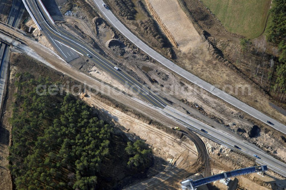 Aerial photograph Nuthetal bei Saarmund / BRB - Nuthetal Das Autobahndreieck Nuthetal (A 10 und A 115) bei Potsdam, aufgenommen aus der Luft am 23.01.2008. Das am stärksten befahrene Autobahnteilstück Brandenburgs wird derzeit für 34 Millionen Euro umgebaut.Die Bauarbeiten des Landesbetriebes Straßenwesen beinhalten u.a. den Ausbau des Verbindungsteilstücks zwischen der A 10 und der A 115 , er wird bis 2010 dauern. Während hier derzeit täglich knapp 153.000 Fahrzeuge gezählt werden, sollen es 2015 bereits mehr als 200.000 sein. Ausführende Firmen sind die EUROVIA VBU und BERGER BAU.