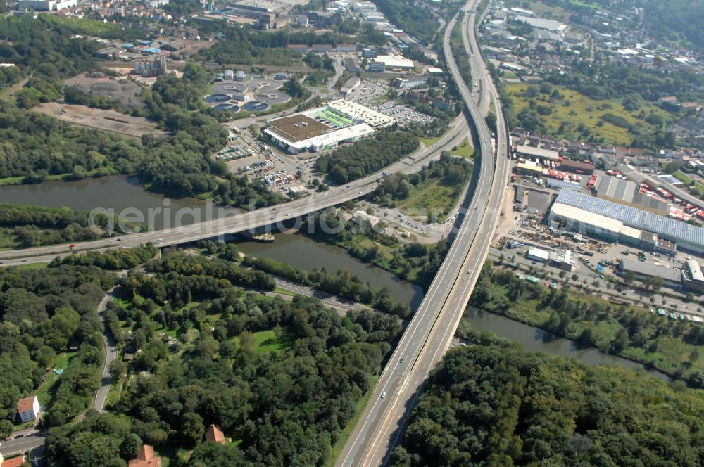 Aerial image Saarbrücken - Blick aus Westen vom Stadtteil St. Arnual über die Saar auf das Autobahndreieck Saarbrücken im Stadtteil Güdingen mit der Bundesautobahn A 620 und A6 im Saarland. Die Autobahn A6 führt über die Saartalbrücke. View from west over the Saar river of the motorway junction Saarbrücken.