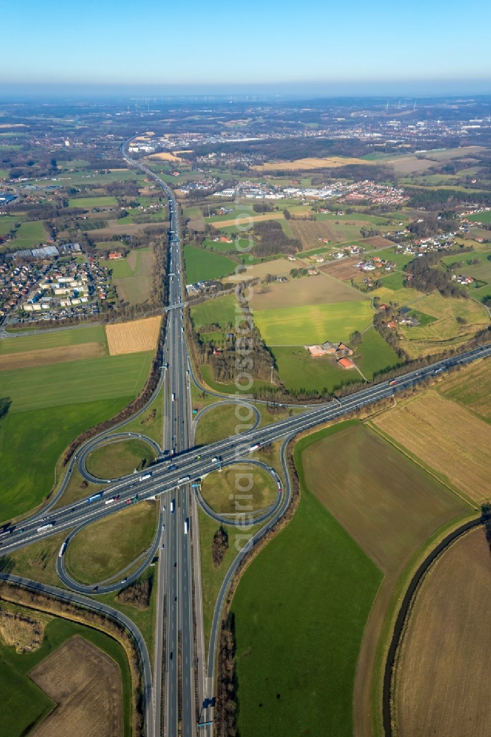 Lotte from the bird's eye view: Traffic flow at the intersection- motorway A30 - A1 Kreuz Lotte/Osnabrueck in form of cloverleaf in Lotte in the state North Rhine-Westphalia, Germany