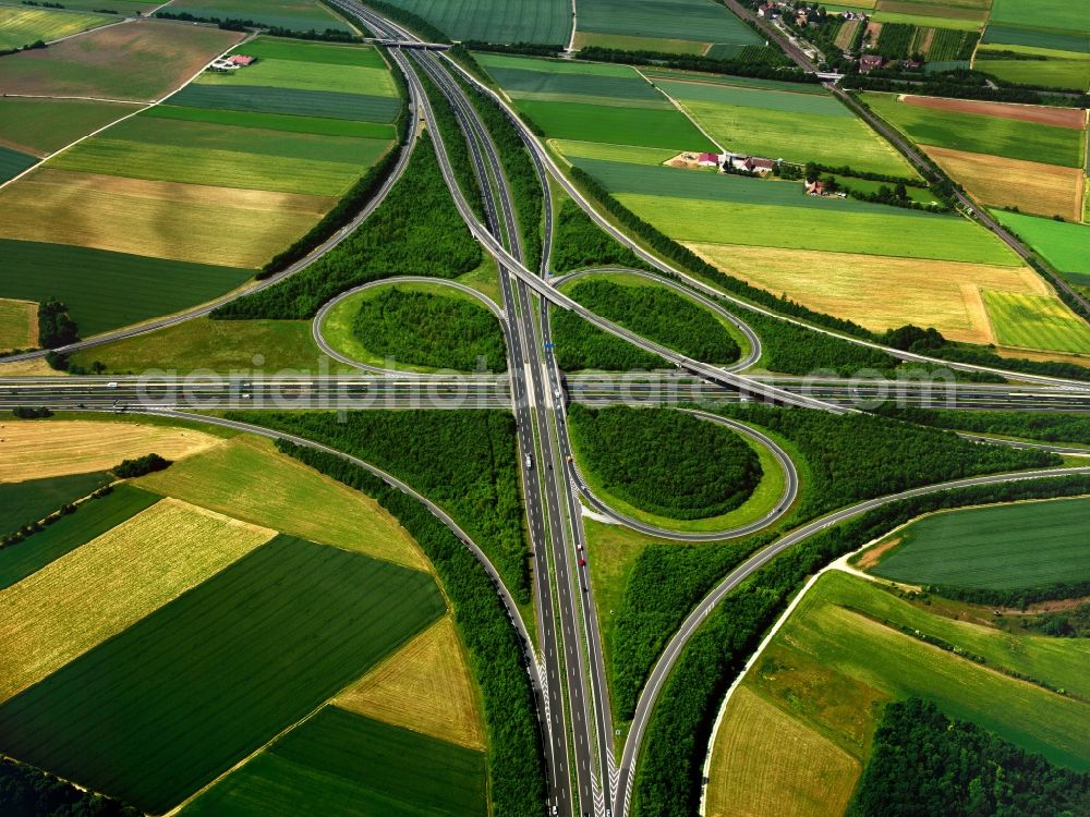 Aerial image Biebelried - Motorway junction Biebelried in the borough of Biebelried in the state of Bavaria. The interchange connects in a clover-leaf shape the federal motorways A3 and A7. The motorway interchange is surrounded by fields in the North of the namegiving borough