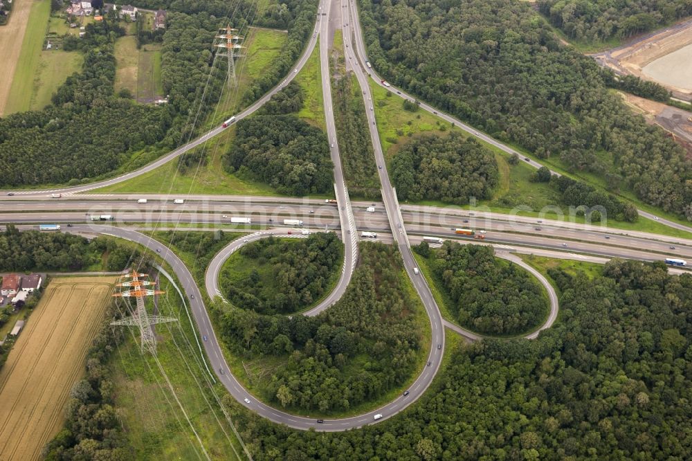 Dortmund from the bird's eye view: View at the highway junction Dortmund-North West in Dortmund in North Rhine-Westphalia. The trumpet-shaped so-called highway junction connects the highways A 2 and A 45 with each other. Additionally, it is the exit Mengede in directions Dortmund-Mengede and Waltrop. Responsible is the state owned Straßen.NRW