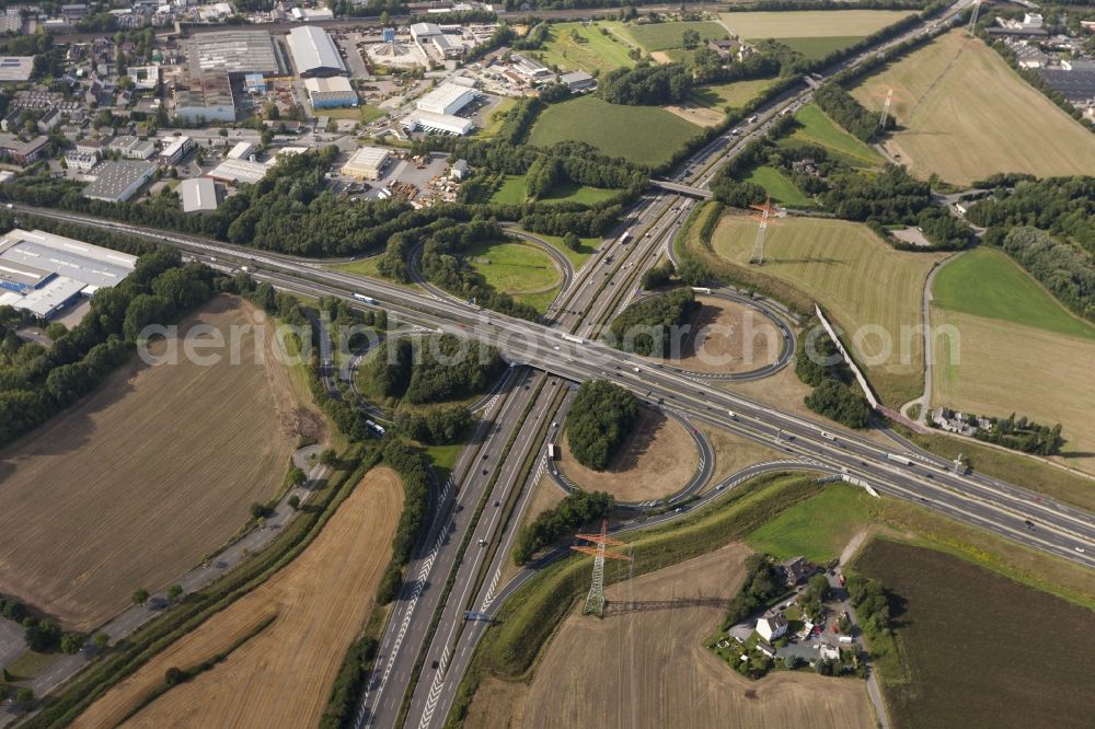 Aerial photograph Dortmund - View at the motorway intersection Dortmund-West in Dortmund in the federal state North Rhine-Westphalia . The junction has the shape of a clover leaf and connects the federal motorways A40 and A45 together. Responsible is the state owned Straßen.NRW