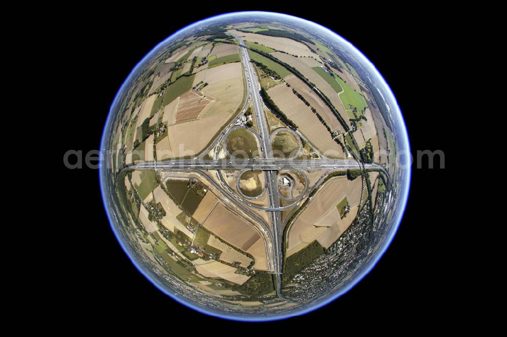 Aerial image Kamen - Fish-eye - Blick auf das Autobahnkreuz Kamen in Nordrhein-Westfallen. 1937 wurde das Autobahnkreuz eingeweiht und ist damit eines der ältesten deutschen Autobahnkreuze in Kleeblattform. Am Kamenerkreuz zwischen Dortmund und Hamm kreuzen sich die Autobahnen A1 und A2, täglich wird es von ca. 150.000 Fahrzeugen befahren. Seit 2009 ist das Kreuz nach vierjÃ¤hriger Bauzeit sechsspurig befahrbar. Kontakt: Landesbetrieb Straßenbau Nordrhein-Westfalen, Tel. (0209) 3808-0, kontakt@strassen.nrw.de