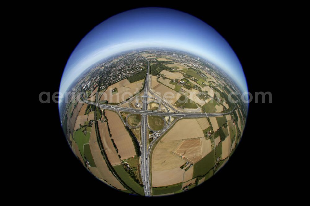 Aerial photograph Kamen - Fish-eye - Blick auf das Autobahnkreuz Kamen in Nordrhein-Westfallen. 1937 wurde das Autobahnkreuz eingeweiht und ist damit eines der ältesten deutschen Autobahnkreuze in Kleeblattform. Am Kamenerkreuz zwischen Dortmund und Hamm kreuzen sich die Autobahnen A1 und A2, täglich wird es von ca. 150.000 Fahrzeugen befahren. Seit 2009 ist das Kreuz nach vierjÃ¤hriger Bauzeit sechsspurig befahrbar. Kontakt: Landesbetrieb Straßenbau Nordrhein-Westfalen, Tel. (0209) 3808-0, kontakt@strassen.nrw.de