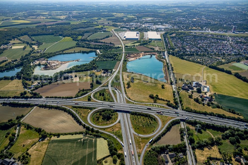 Aerial image Moers - Traffic flow at the intersection- motorway A57 und A42 in Moers in the state North Rhine-Westphalia, Germany