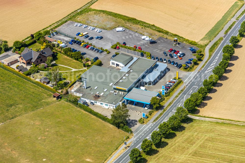 Aerial image Langenholthausen - Car dealership building Autohaus Carl Bichmann GmbH & Co. KG on street Neuenrader Strasse in Langenholthausen in the state North Rhine-Westphalia, Germany