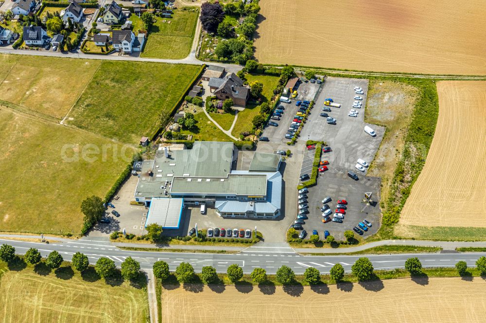 Aerial photograph Langenholthausen - Car dealership building Autohaus Carl Bichmann GmbH & Co. KG on street Neuenrader Strasse in Langenholthausen in the state North Rhine-Westphalia, Germany