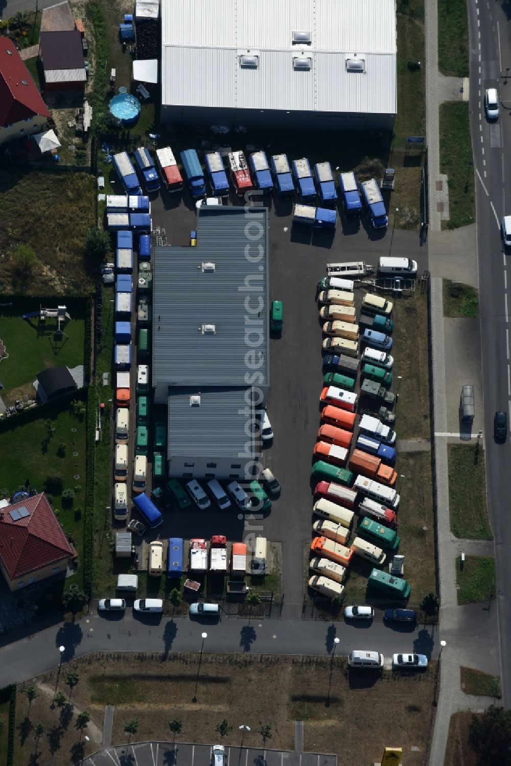 Aerial photograph Berlin - Car dealership building Autoservice Wendler for used vehicles like police cars, fire trucks, vehicles of the technical aid organization, ambulances, military vehicles and trucks in the Koepenicker Strasse in Berlin