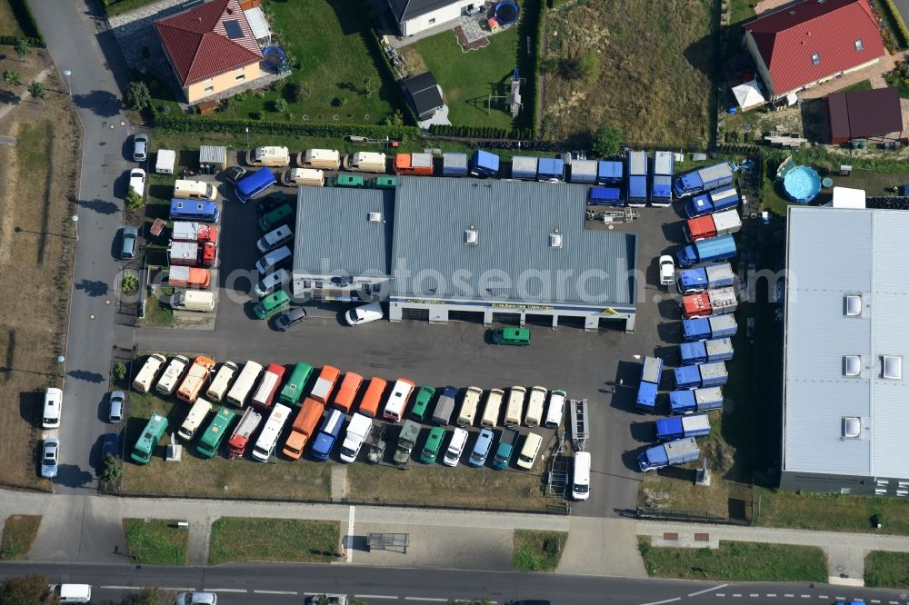 Berlin from the bird's eye view: Car dealership building Autoservice Wendler for used vehicles like police cars, fire trucks, vehicles of the technical aid organization, ambulances, military vehicles and trucks in the Koepenicker Strasse in Berlin