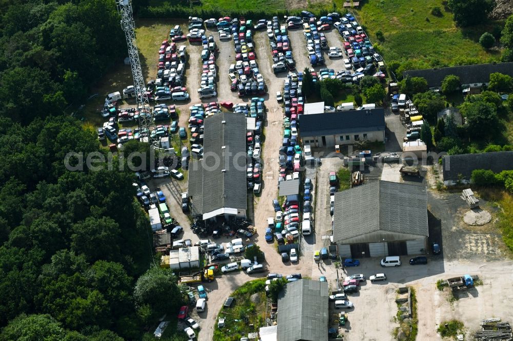 Aerial photograph Falkenberg - Scrapyard for recycling of cars cars and used vehicles with decomposition and aftermarket Autoverwertung Domke-Krause in Gewerbegebiet in Falkenberg in the state Brandenburg, Germany