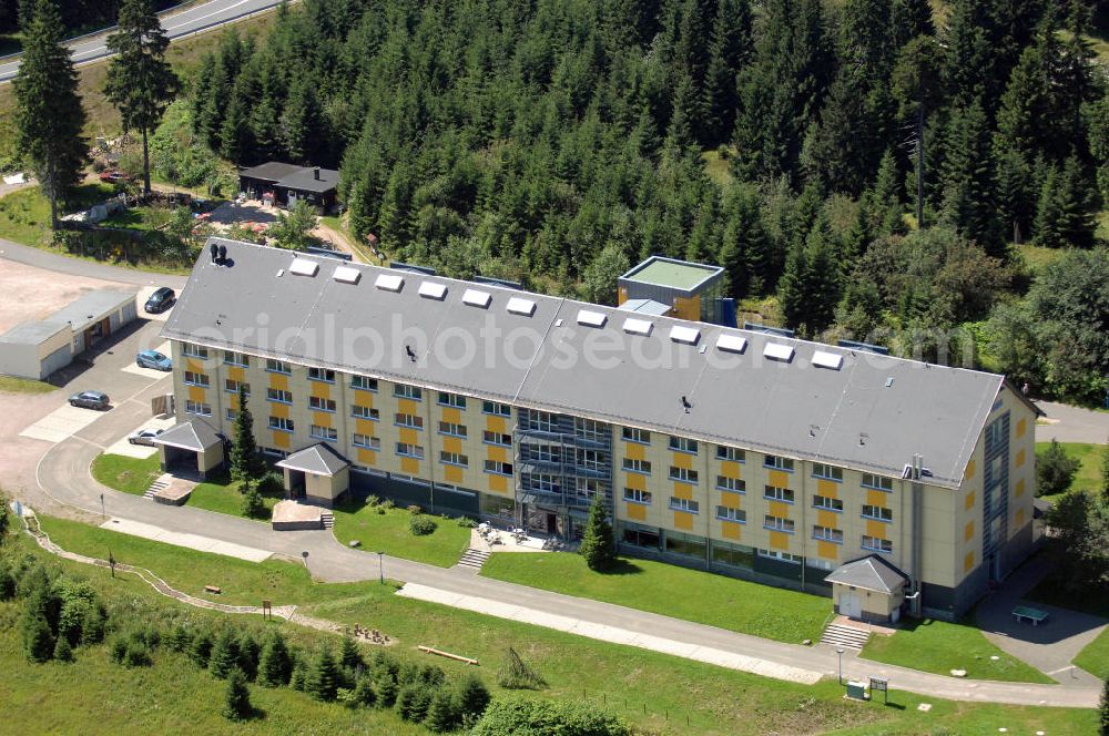 Aerial photograph Oberhof - Blick auf das Ferienzentrum Oberhof / Rennsteig, ein Haus der AWO Sano Thüringen gGmbH. Das Haus besitzt 66 Zimmer sowie Tagungs- und Veranstaltungsräume. Es ist ca. 10 km von Oberhof entfernt und liegt am Waldrand des Rennsteiggebietes. Oberhof ist als deutsches Wintersportzentrum bekannt. Besonders populär sind hier die Sportarten Biathlon, Rennrodeln bzw. Bobsport, Skilanglauf und die Nordische Kombination. Die Stadt lebt vom Tourismus. Kontakt AWO SANO Ferienzentrum Oberhof / Rennsteig: info@awosano.de